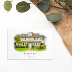 Postcard printed with a watercolor-style portrait of a house, titled 'The Jackson Home', beside green leaves